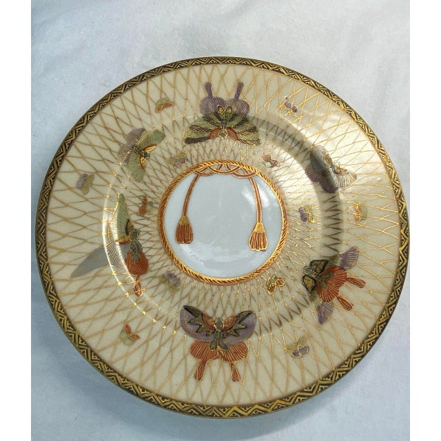 This elegant pair of Japanese porcelain plates dates to the late Meiji period, circa 1890, and showcases the refined...