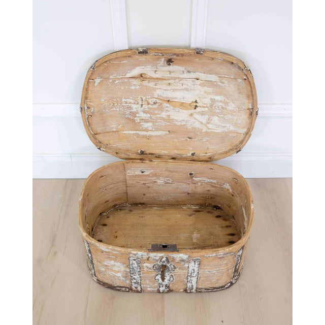 Made in Sweden around 1850, this scraped pine strong box is a small chest of the kind once used to keep valuables safe. It...