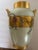 A Limoges porcelain hand painted circa 1920 2-handle vase featuring an Asian child under an umbrella. It is a white...