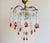 Vintage 1980s milk glass chandelier redesigned with amber crystal drops and clear crystals. The brass structure shows...