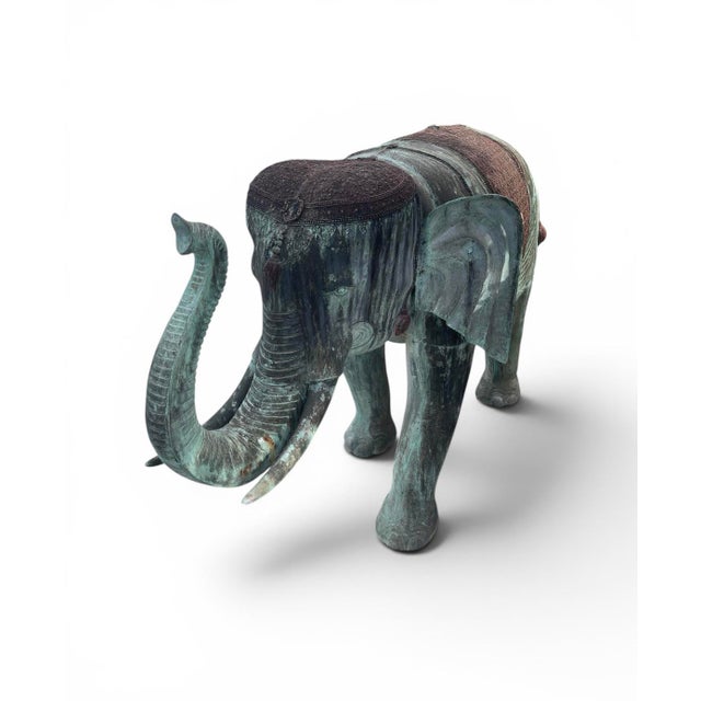 Bring a majestic, worldly presence to your estate or garden with this striking pair of vintage bronze elephant statues....