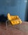 A beautiful, rare armchair with a chromed steel base and tan leather upholstery in very good condition. The Osaka SZ08...