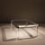 ​This striking square coffee table is an exceptional statement piece of 1970s Hollywood Regency design. It impresses with...