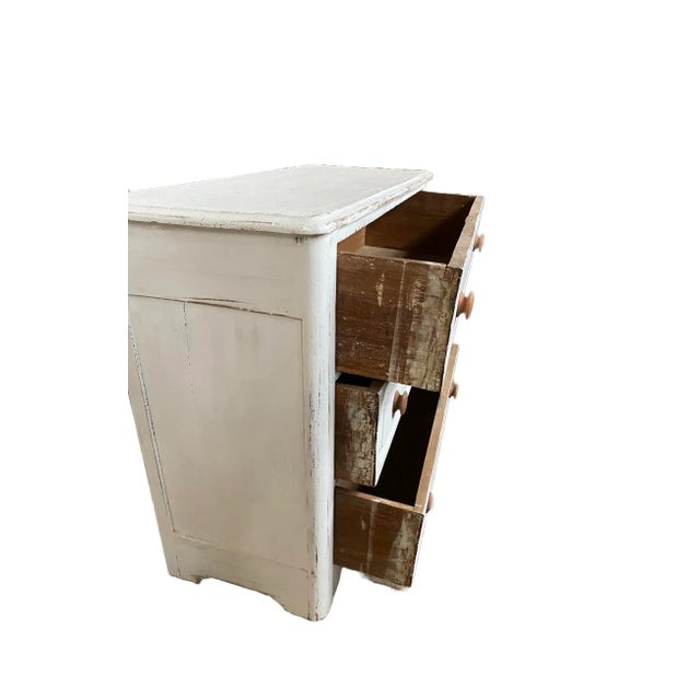 A cottage chest with three drawers. This piece has been restored and painted white. The chest was made in the early 1990's...