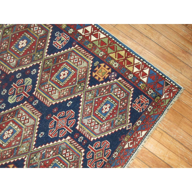 An early 20th century finely woven, jewel toned antique Shirvan rug from the Caucasus. 3'4'' x 5'2''
