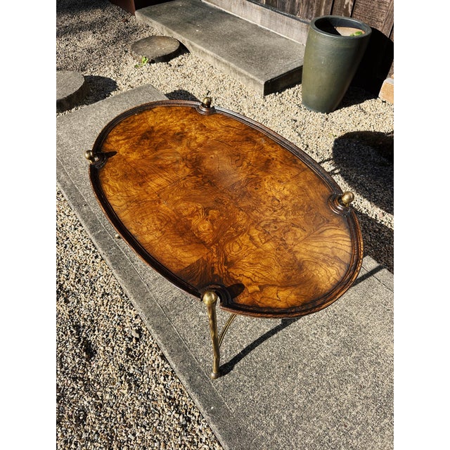 Nice patch burlwood + brass oval coffee table in the style of Mastercraft / Maison Baguès. Lacqured brass with patch burl....