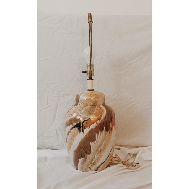 Mid century glazed Ceramic Ginger Jar Style Lamp. Vibrant colors include orange, black, brown& white. Same lamp can be...