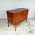 Four drawers arranged as two short drawers across the top and two full-width drawers beneath, set within a shallow...