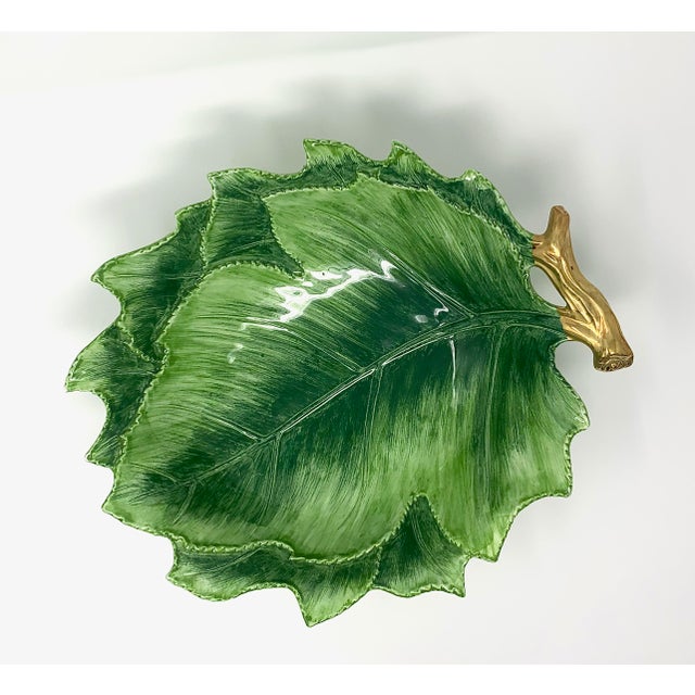 A wide, leaf-shaped serving bowl, hand-painted in Italy. As hand-painted work, expect slight variation in the glaze and...