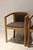 pair of vintage Scandinavian-inspired barrel back armchairs crafted from solid oak with elegantly curved wraparound arms...