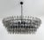 Italian oval shaped chandelier with smoky polyhedron / polyhedral shaped Murano glasses mounted on matte black powder...