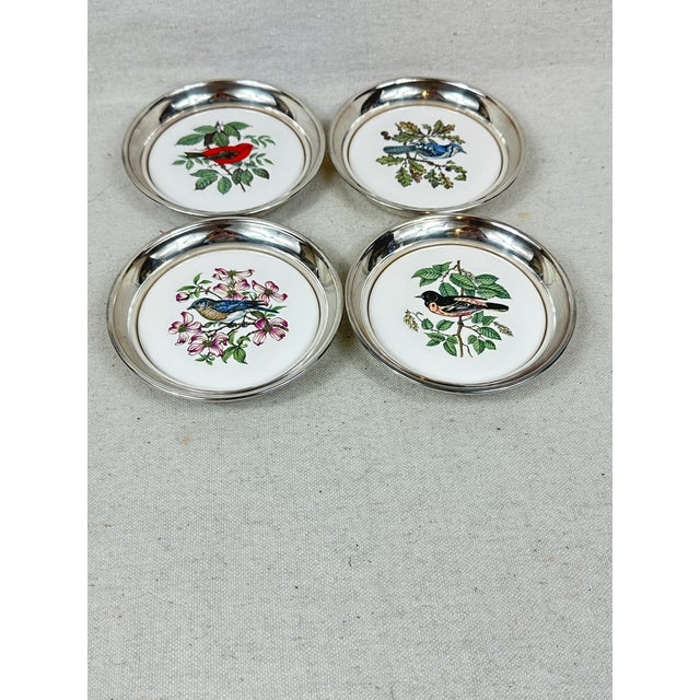 Vintage Sheridan silver plated coasters decorated with a ceramic insert featuring four different birds. These are pre-...