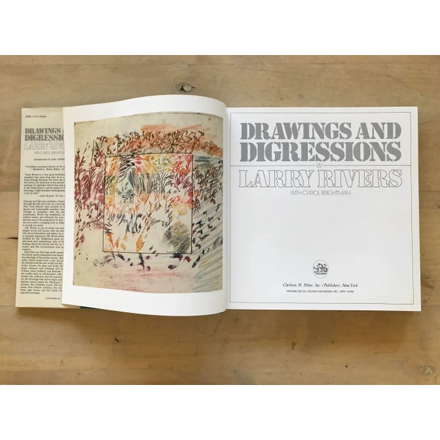 Hardcover book with dust jacket and clear polypropylene jacket cover.