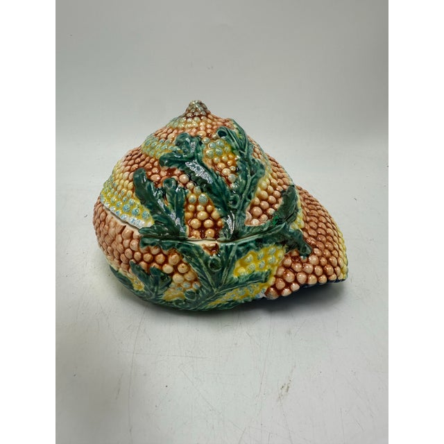 This is a a vintage Italian ceramic shell-shaped trinket box or covered dish made in Vietri, Italy. The piece features a...