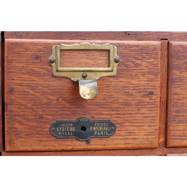 This oak card catalogue cabinet was made in France in the early twentieth century, originally used as part of a library or...