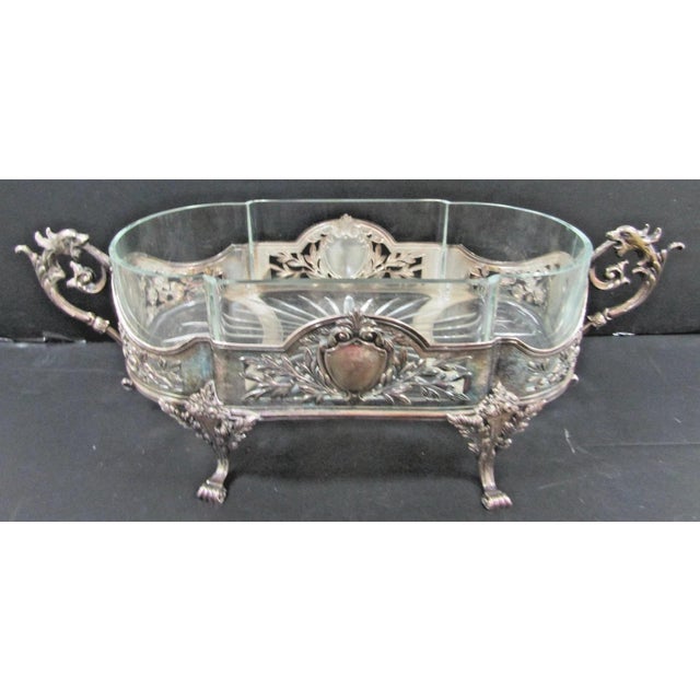 The Topazio Portuguese Sterling Silver Crystal Centerpiece Jardiniere with Dragon Handles is a stunning piece of art...