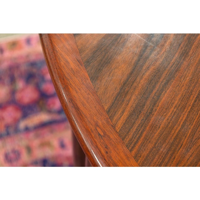 A vintage Skovby extendable dining table. This is an absolutely stunning Danish dining table featuring a lovely rosewood...