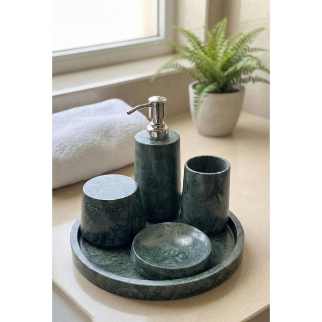 Designed and hand-carved by Artefactia from solid Udaipur Green Marble, this five-piece bath accessory set brings a...