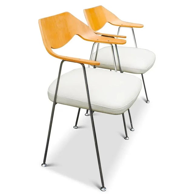 Pair of hille by british designer robin day model 675 bent oak plywood & chrome easy chair with white leather seats 1960s...