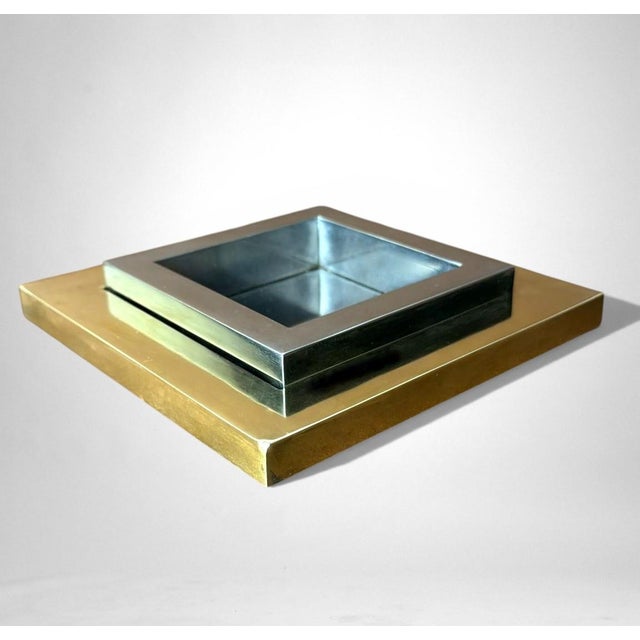 Elegant Italian tabletop ashtray crafted in polished steel and brass, distinguished by a refined interplay of geometric...