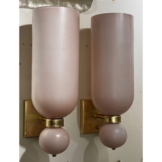 This product is a pair of Murano glass pink matte cone form sconces, adding a touch of elegance to any space. The sconces...