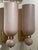 This product is a pair of Murano glass pink matte cone form sconces, adding a touch of elegance to any space. The sconces...