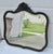 Antique (1890's) Wall Mirror has a Victorian Style. Wood Frame. Mahogany. Oval in Shape, Beveled Glass, Love Bird...