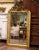 Decorate a powder room with this elegant antique gilt mirror! Crafted in France, circa 1870, the mirror is decorated at...