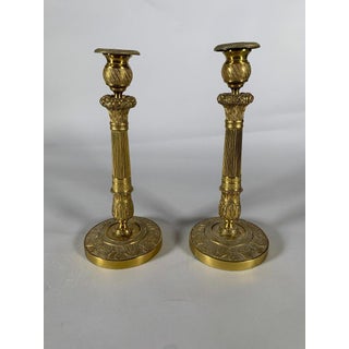 Pair of bronze candlesticks "with fruit baskets", Empire period, 19th century For Sale