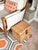 A handsome vintage woven rattan storage box designed to accommodate letter-size hanging files while doubling as decorative...