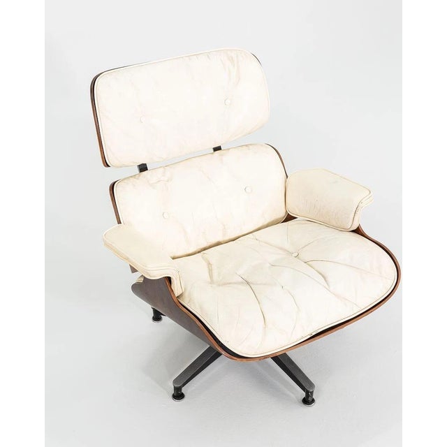 Own a definitive piece of design history. This 1964 Eames Lounge Chair and Ottoman is a rare survivor from the 'Golden...