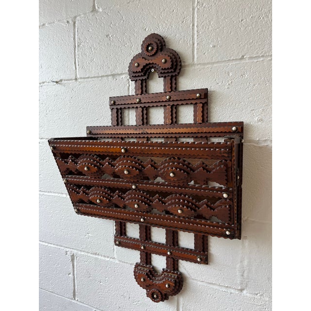An impressive antique American Tramp Art wall-mounted letter holder dating to the late Victorian period, circa 1890–1915....