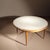​This round coffee table was produced in the workshops of Berthold Müller. The tabletop features a mosaic of light,...