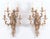 Elegant pair of French Louis XV style five-light ormulu brass wall sconces, finely crafted with an elaborate scrolling...