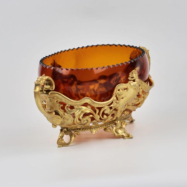 Bronze jardiniere with glass at the turn of the 19th and 20th Centuries. With a melodic bronze pattern.