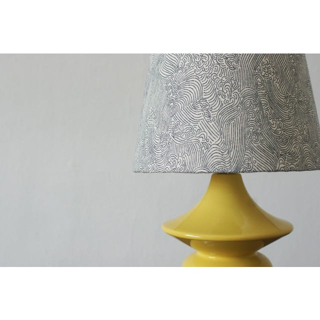 This ceramic lamp, produced by Hasle Keramik on the island of Bornholm, is a perfect example of Danish design inspired by...