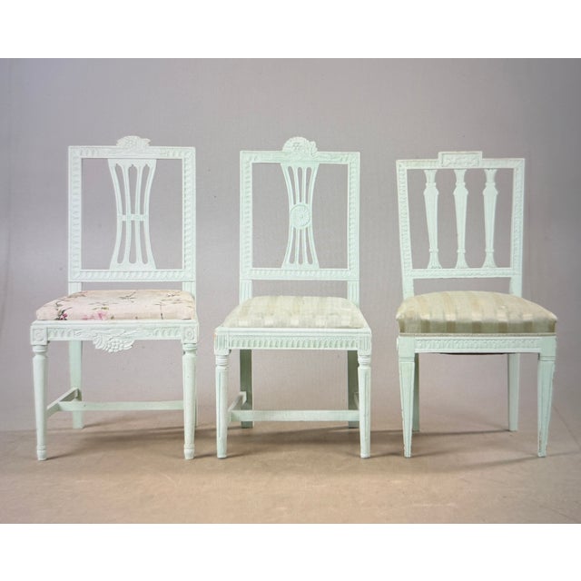 Here is a set of eight Gustavian chairs. Each piece is unique, yet they form a set. The upholstery is currently turquoise...