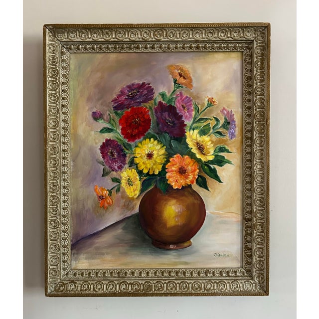 1940’s vintage, brightly colored, floral still life oil painting on canvas. In vintage, white washed ornate wood frame....