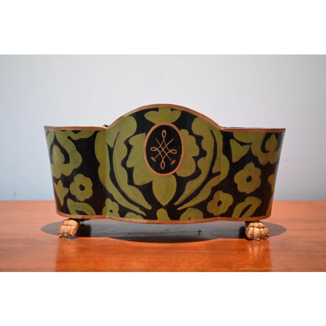 This cachepot or jardinière by Dana Gibson features a bold khaki green design on black surrounding a cartouche with a gold...