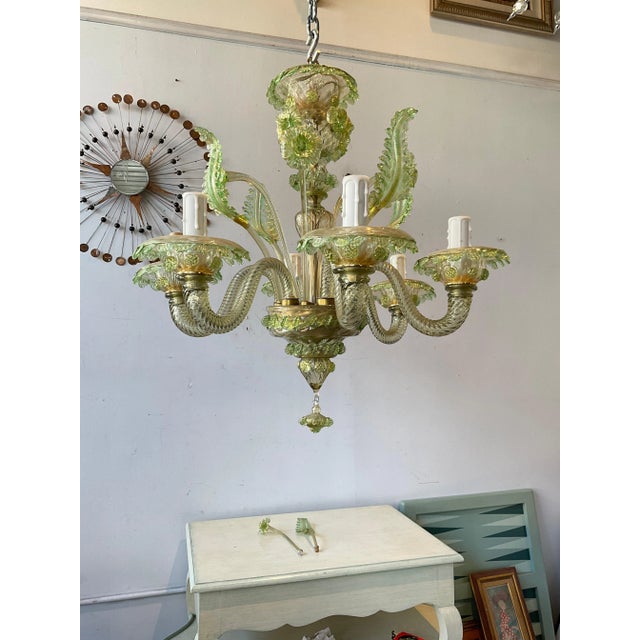 1950s Murano glass green chandelier. Originally this chandelier had more stems. Some are missing so it’s now evened out....