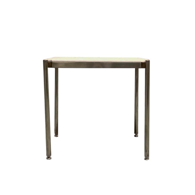 Designed by Osvaldo Borsani for Tecno, this low coffee table embodies the essence of structural elegance and mid-20th-...