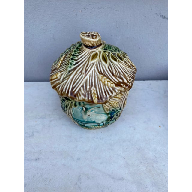 Majolica tobacco jar signed Onnaing, circa 1890. Decorated with a goat and wheat and leaves.