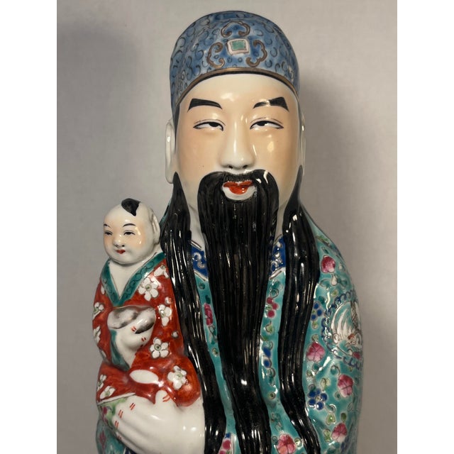 An impressive Late Qing to Early Republic Chinese porcelain figurine depicting Lu Xing (禄星), the revered deity of wealth,...