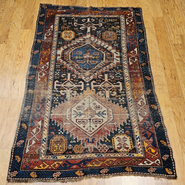 This beautiful Caucasian Kazak area rug, dating to the late 19th century, showcases the timeless artistry of village...