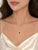 Elegant 14K pink rose gold pendant necklace featuring a natural pear-shaped sapphire weighing 1.4 carats, accented by...