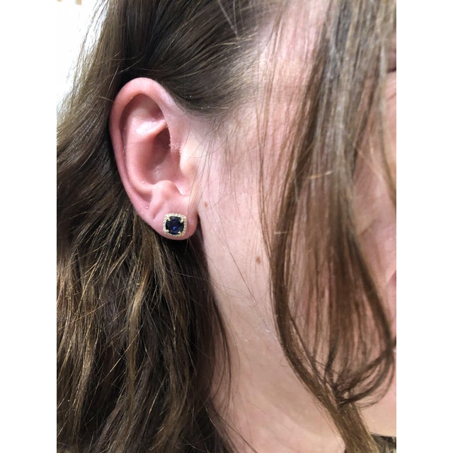 These beautiful stud earrings feature a pair of 2.87 carat weight cushion cut sapphire gemstones with natural earth mined...