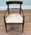 Elegant Regency style mahogany carver armchair with a broad curved top rail Decorative rope-twist cross rail beneath the...