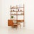 This elegant teak wall unit with a small desk and a dresser was made in denmark in the 1970s and perfectly reflects the...