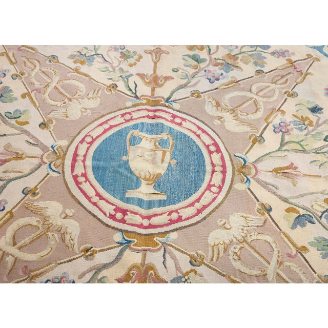 An exquisite early 20th-century French Aubusson flatweave rug featuring a classical central medallion. The central roundel...
