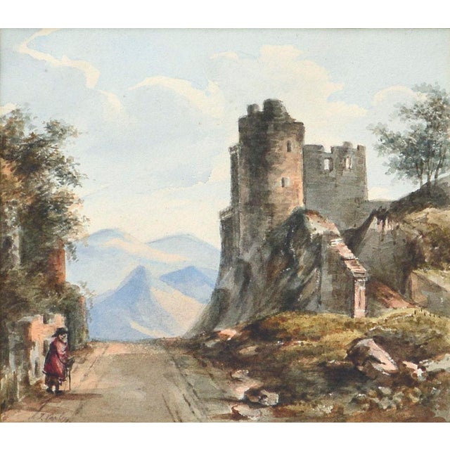 Watercolor of castle ruins along a road possibly by John Varley (jr.?). In the foreground, there is a figure with a hat,...